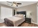 Main bedroom with a king-size bed and bay window at 6233 Morning Splendor Way, Las Vegas, NV 89110