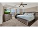 Main bedroom with bay window and ceiling fan at 6233 Morning Splendor Way, Las Vegas, NV 89110