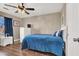 Bedroom with ceiling fan and blue bedding at 6233 Morning Splendor Way, Las Vegas, NV 89110