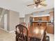 Open dining area with a view into the kitchen and living room at 6233 Morning Splendor Way, Las Vegas, NV 89110