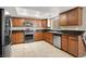 Modern kitchen with stainless steel appliances and ample cabinetry at 6233 Morning Splendor Way, Las Vegas, NV 89110