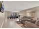 Comfortable living room with neutral color palette and tile floors at 6233 Morning Splendor Way, Las Vegas, NV 89110