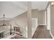 Upstairs hallway with white railing overlooking living area at 6233 Morning Splendor Way, Las Vegas, NV 89110