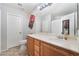 Clean bathroom with wood cabinets and a large mirror at 6255 W Arby Ave # 218, Las Vegas, NV 89118