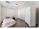 Spacious bedroom with hardwood floors and a white armoire at 6255 W Arby Ave # 218, Las Vegas, NV 89118