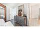 Bedroom with dresser, mirror, and view of bathroom at 6255 W Arby Ave # 218, Las Vegas, NV 89118