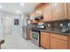 Modern kitchen with wood cabinets and stainless steel appliances at 6255 W Arby Ave # 218, Las Vegas, NV 89118