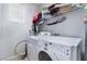 Laundry room with washer, dryer, and shelving at 6255 W Arby Ave # 218, Las Vegas, NV 89118