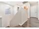 Upstairs hallway with wooden flooring and staircase at 6255 W Arby Ave # 218, Las Vegas, NV 89118