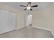 Bright bedroom with tile floors and ceiling fan at 6436 Whippoorwill Way, Las Vegas, NV 89103