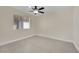 Spacious bedroom with large window and ceiling fan at 6436 Whippoorwill Way, Las Vegas, NV 89103