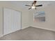 Bedroom with double door closet and ceiling fan at 6436 Whippoorwill Way, Las Vegas, NV 89103