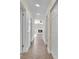 Light-filled hallway with view of fireplace at 6436 Whippoorwill Way, Las Vegas, NV 89103