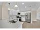 Modern white kitchen with stainless steel appliances at 6436 Whippoorwill Way, Las Vegas, NV 89103