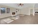 Bright living room with a fireplace and wood-look flooring at 6436 Whippoorwill Way, Las Vegas, NV 89103