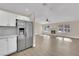 Bright living room with fireplace and hardwood floors, open to kitchen at 6436 Whippoorwill Way, Las Vegas, NV 89103