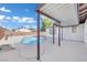 Relaxing pool area with covered patio and surrounding landscaping at 6436 Whippoorwill Way, Las Vegas, NV 89103