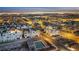 Aerial view of a community at night, featuring homes, a pool, and city lights at 650 Sentinel Spire St, Las Vegas, NV 89138