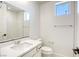 Clean and bright bathroom with white tile and vanity at 650 Sentinel Spire St, Las Vegas, NV 89138