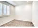 Simple bedroom with neutral carpeting and window shutters at 650 Sentinel Spire St, Las Vegas, NV 89138