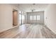 Spacious living room with wood-look floors and sliding glass doors at 650 Sentinel Spire St, Las Vegas, NV 89138