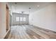 Spacious living room with wood-look floors and sliding glass doors at 650 Sentinel Spire St, Las Vegas, NV 89138