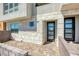 Modern townhome entrance with stone and glass details at 650 Sentinel Spire St, Las Vegas, NV 89138