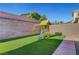 Artificial turf backyard with playset at 6819 Rolling Boulder St, Las Vegas, NV 89149