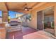 Outdoor kitchen and patio with ceiling fan at 6819 Rolling Boulder St, Las Vegas, NV 89149