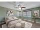 Spacious bedroom with ceiling fan and large windows at 6819 Rolling Boulder St, Las Vegas, NV 89149