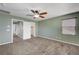 Bedroom with ceiling fan and access to bathroom at 6819 Rolling Boulder St, Las Vegas, NV 89149