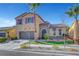 Two-story house with purple shutters, stone accents, and a landscaped yard at 6819 Rolling Boulder St, Las Vegas, NV 89149