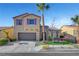 Two-story house with purple shutters, stone accents, and a landscaped yard at 6819 Rolling Boulder St, Las Vegas, NV 89149