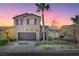 Two-story house with purple shutters, stone accents, and a landscaped yard at 6819 Rolling Boulder St, Las Vegas, NV 89149