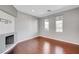 Bright home office featuring hardwood floors and a fireplace at 6819 Rolling Boulder St, Las Vegas, NV 89149