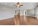 Open living room with hardwood floors, high ceilings and a view to the kitchen at 6819 Rolling Boulder St, Las Vegas, NV 89149