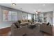 Living room with hardwood floors, built-ins, and comfy furniture at 6819 Rolling Boulder St, Las Vegas, NV 89149