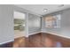 Hardwood floor living room with a view of the kitchen and access to other rooms at 6819 Rolling Boulder St, Las Vegas, NV 89149