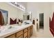 Double sink bathroom with a large mirror at 6901 Copper Kettle Ave, Las Vegas, NV 89130