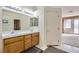 Bathroom with double sinks and a door to bedroom at 6901 Copper Kettle Ave, Las Vegas, NV 89130