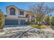 Two-story house with a landscaped yard, two-car garage, and gated entry at 6901 Copper Kettle Ave, Las Vegas, NV 89130