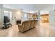 Living room with tile floors, fireplace, and view into kitchen area at 6901 Copper Kettle Ave, Las Vegas, NV 89130