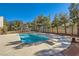 Inviting swimming pool with diving board and large backyard at 6901 Copper Kettle Ave, Las Vegas, NV 89130