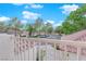 Community view from a private balcony, showcasing manicured landscaping and ample parking at 6948 Emerald Springs Ln, Las Vegas, NV 89113