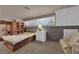 Upstairs bedroom with sitting area and built-in shelving at 6948 Emerald Springs Ln, Las Vegas, NV 89113