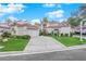 Two-story house with tile roof, attached garage, and landscaped yard at 6948 Emerald Springs Ln, Las Vegas, NV 89113