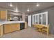 Modern kitchen with light wood cabinets and quartz countertops at 6948 Emerald Springs Ln, Las Vegas, NV 89113