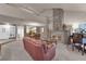 Living room features a fireplace, and a view into the dining area at 6948 Emerald Springs Ln, Las Vegas, NV 89113