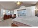 Large main bedroom with high ceilings and sliding glass doors at 6948 Emerald Springs Ln, Las Vegas, NV 89113