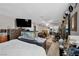 Bedroom with large TV, dresser, and aquarium at 7026 Westpark Ct, Las Vegas, NV 89147